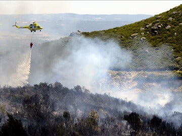 Extinción del fuego en Oímbra, Ourense, en junio