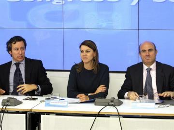 Carlos Floriano, Dolores de Cospedal y Luis de Guindos, en la sede del PP