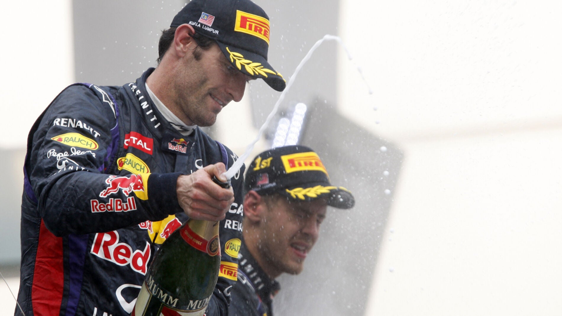 Webber y Vettel en el podio de Malasia
