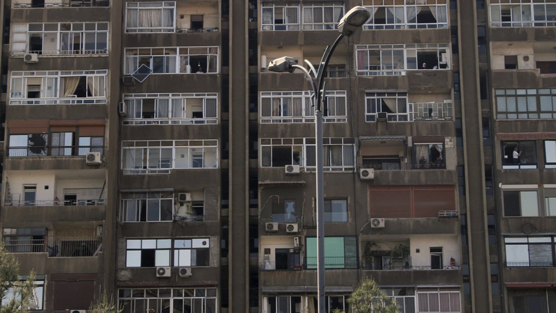 Vista de la fachada de un edificio en el último atentado registrado en Damasco Vista de la fachada de un edificio en el último atentado registrado en Damasco