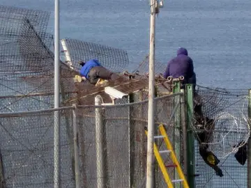 Inmigrantes en la valla de Melilla Inmigrantes en la valla de Melilla
