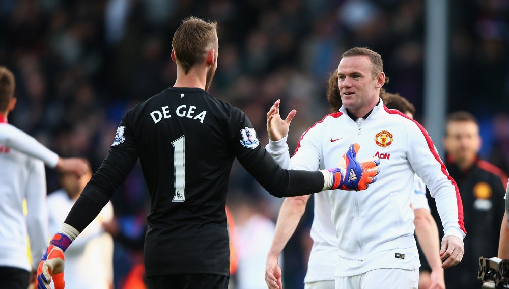 De Gea y Rooney saludándose antes de un partido