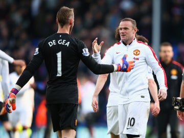 De Gea y Rooney saludándose antes de un partido