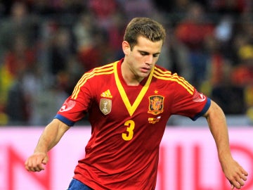 Nacho, en un partido con España