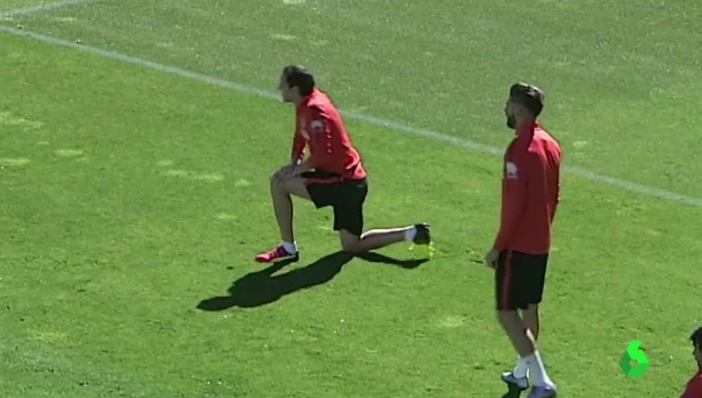Godín y Carrasco, durante el entrenamiento del Atlético de Madrid