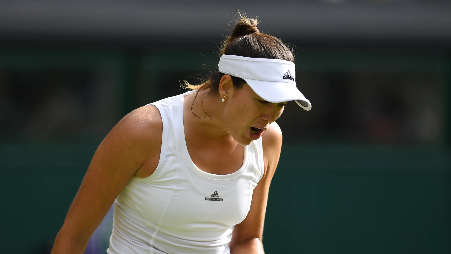 Muguruza celebra un punto ante Camila Giorgi Muguruza celebra un punto ante Camila Giorgi