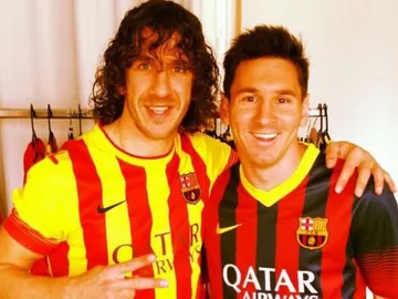 Carles Puyol junto a Leo Messi Carles Puyol junto a Leo Messi
