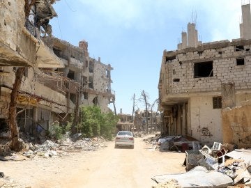 Vista de los daños registrados en algunos edificios, en la ciudad de Al Zabadani, recuperada por el ejército sirio al oeste de Damasco (Siria)