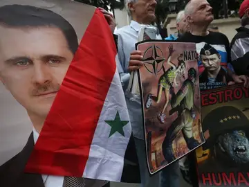 Afines a Al Asad protestan contra EEUU Afines a Al Asad protestan contra EEUU