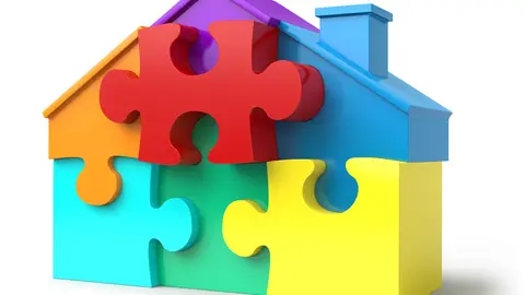 Imagen de un rompecabezas en forma de casa Imagen de un rompecabezas en forma de casa