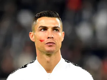 Cristiano Ronaldo, con la cara pintada de rojo Cristiano Ronaldo, con la cara pintada de rojo