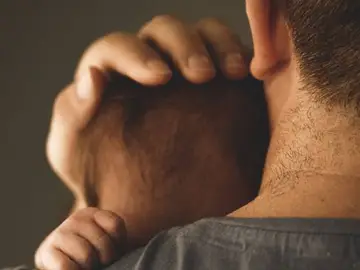 Imagen de archivo de un padre con su bebé Imagen de archivo de un padre con su bebé