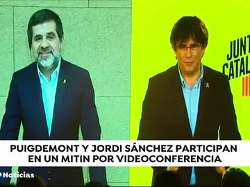 Carles Puigdemont y Jordi Sànchez hacen un mitin a través de una pantalla y piden el voto para "ayudar" a los presos Carles Puigdemont y Jordi Sànchez hacen un mitin a través de una pantalla y piden el voto para "ayudar" a los presos