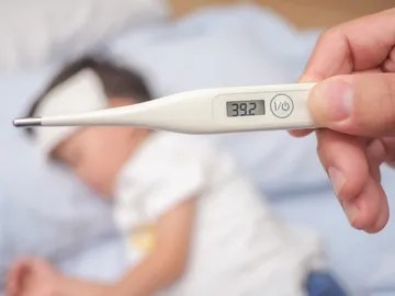 Niño con fiebre Niño con fiebre