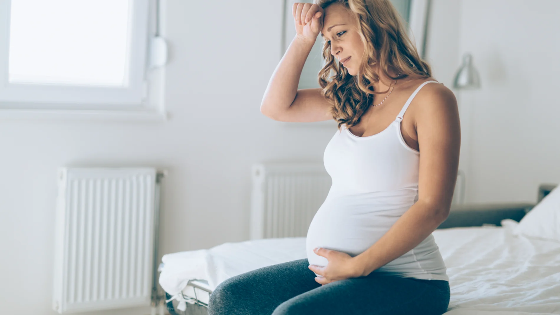 Una mujer embarazada con síntomas de coronavirus Una mujer embarazada con síntomas de coronavirus