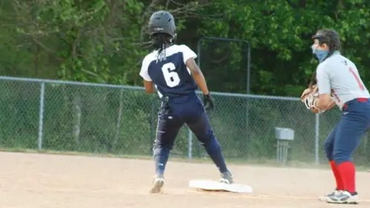 The referee forces the softball player to remove the beads and cut their hair in North Carolina