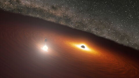 Concepci&oacute;n art&iacute;stica del sistema binario de agujeros negros en la galaxia OJ 287. 