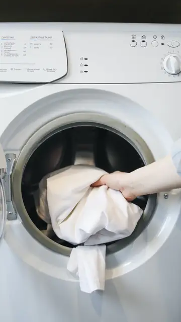 Prendas de plumas en la lavadora Prendas de plumas en la lavadora