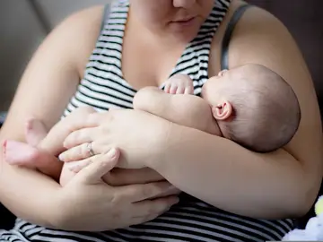 Una madre con su bebé Una madre con su bebé