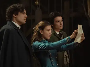 Henry Cavill as Sherlock Holmes, Millie Bobby Brown as Enola Holmes, Louis Partridge as Tewkesbury Henry Cavill as Sherlock Holmes, Millie Bobby Brown as Enola Holmes, Louis Partridge as Tewkesbury