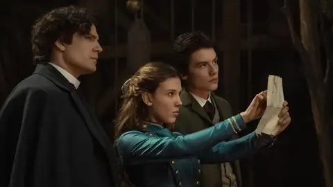 Henry Cavill as Sherlock Holmes, Millie Bobby Brown as Enola Holmes, Louis Partridge as Tewkesbury Henry Cavill as Sherlock Holmes, Millie Bobby Brown as Enola Holmes, Louis Partridge as Tewkesbury