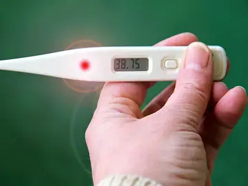 Un termómetro con fiebre Un termómetro con fiebre