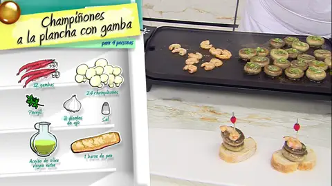 Pincha con un palillo, 1 gamba, 2 champiñones y una rebanada de pan Pincha con un palillo, 1 gamba, 2 champiñones y una rebanada de pan