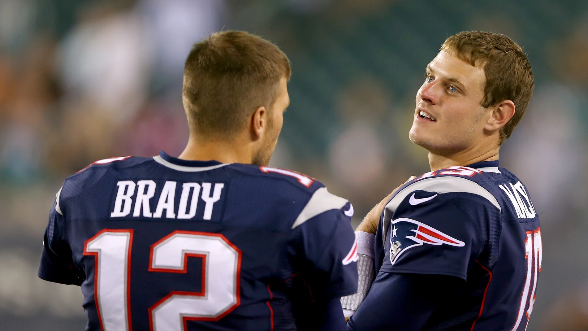 Tom Brady y Ryan Mallett en un partido con los Patriots