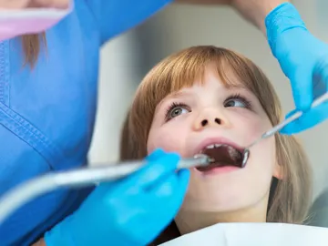 Una niña en el dentista Una niña en el dentista