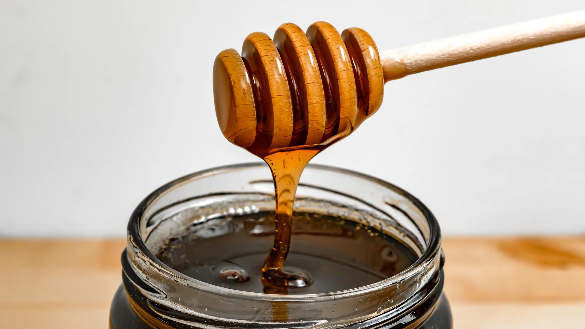 Imagen de archivo de un tarro de miel Imagen de archivo de un tarro de miel