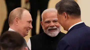 Los tres líderes de las potencias en un momento de la cumbre Los tres líderes de las potencias en un momento de la cumbre