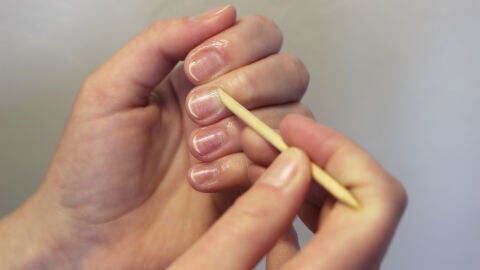 Palito naranjo para las uñas