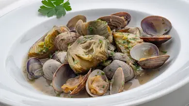 Alcachofas con almejas en salsa verde: una receta nutritiva, ligera y rápida de Karlos Arguiñano Alcachofas con almejas en salsa verde: una receta nutritiva, ligera y rápida de Karlos Arguiñano