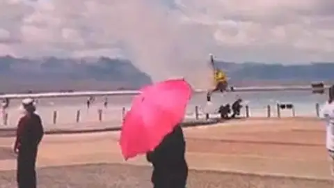 Accidente de helicóptero en una playa de China Accidente de helicóptero en una playa de China