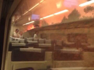 Im&aacute;genes de las llamas en un tren a la altura de Bej&iacute;s