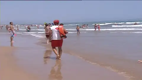 Vigilante en una playa Vigilante en una playa