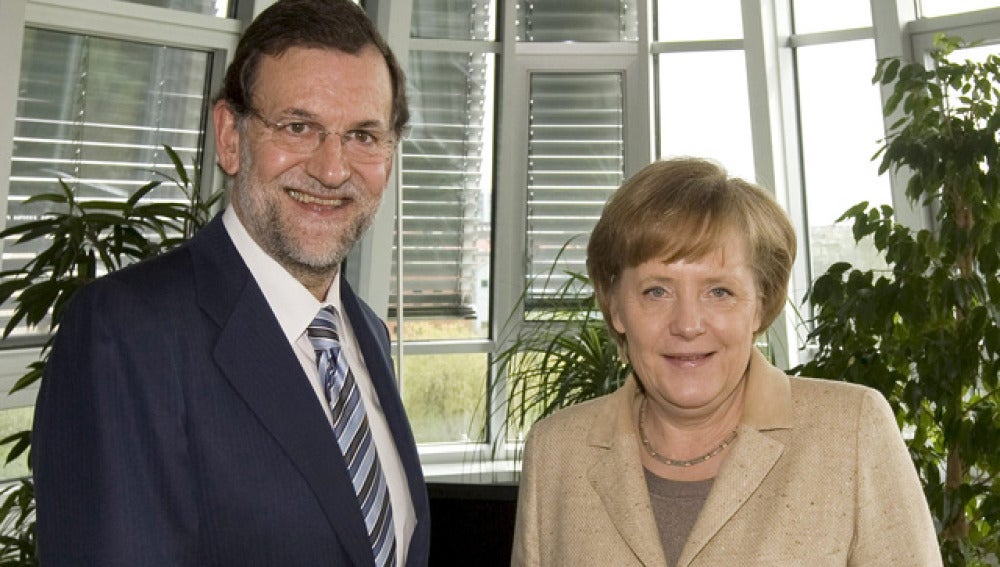 Mariano Rajoy junto a Angela Merkel