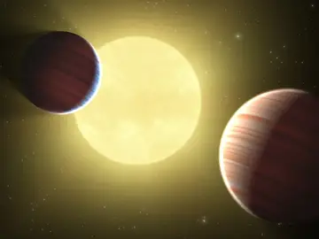 Dos planetas que orbitan alrededor de dos soles Dos planetas que orbitan alrededor de dos soles