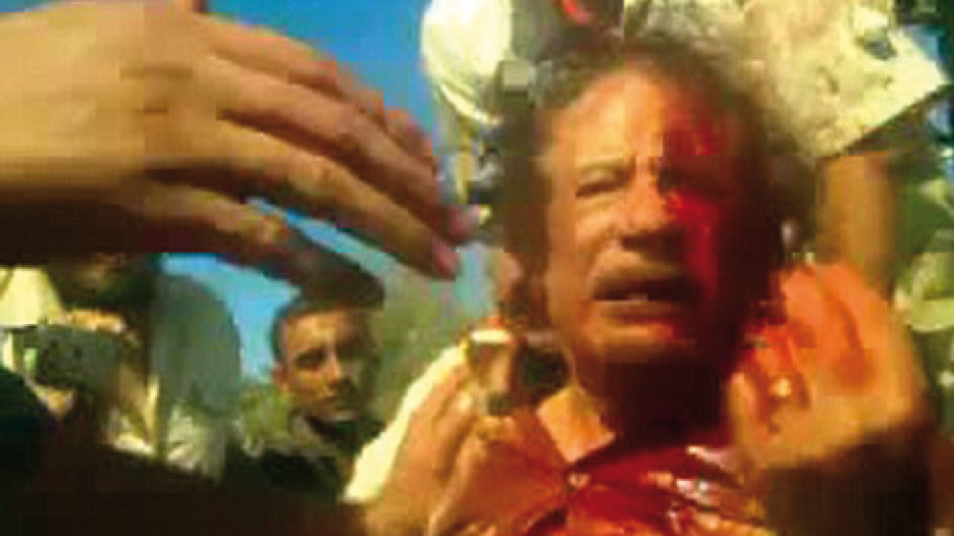 Muammar Gaddafi en el momento de su captura