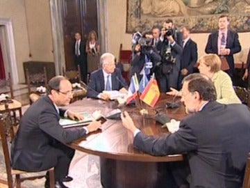 Rajoy con Merkel, Hollande y Monti