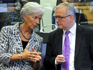 Christine Lagarde charla con Olli Rehn