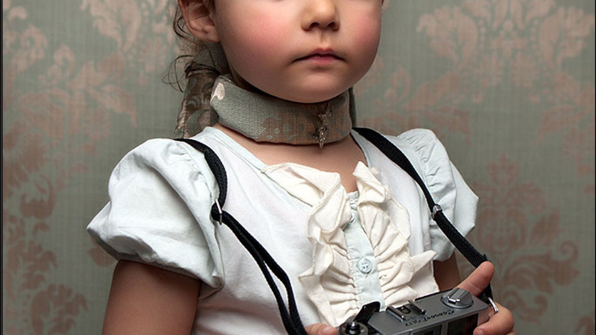 Athena con una c&aacute;mara de fotos