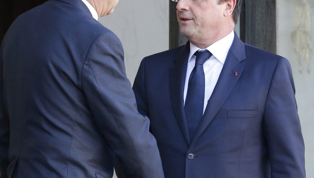 Hollande, con Yves Rocle