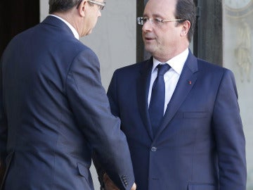 Hollande, con Yves Rocle