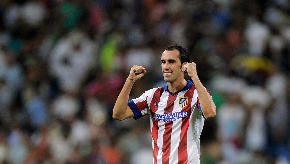 Godín celebra un gol con el Atlético