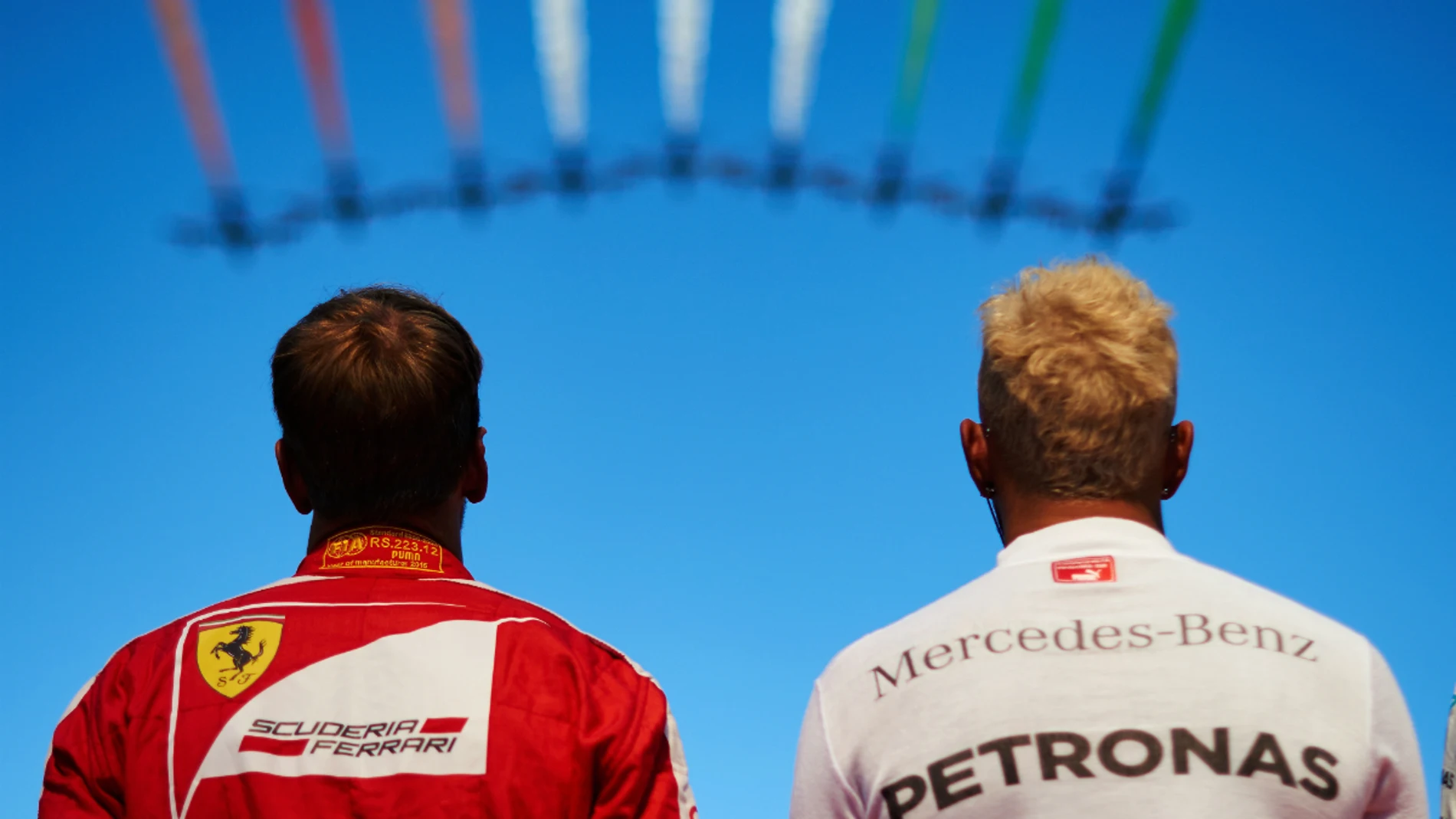Sebastian Vettel y Lewis Hamilton, durante el GP de Italia