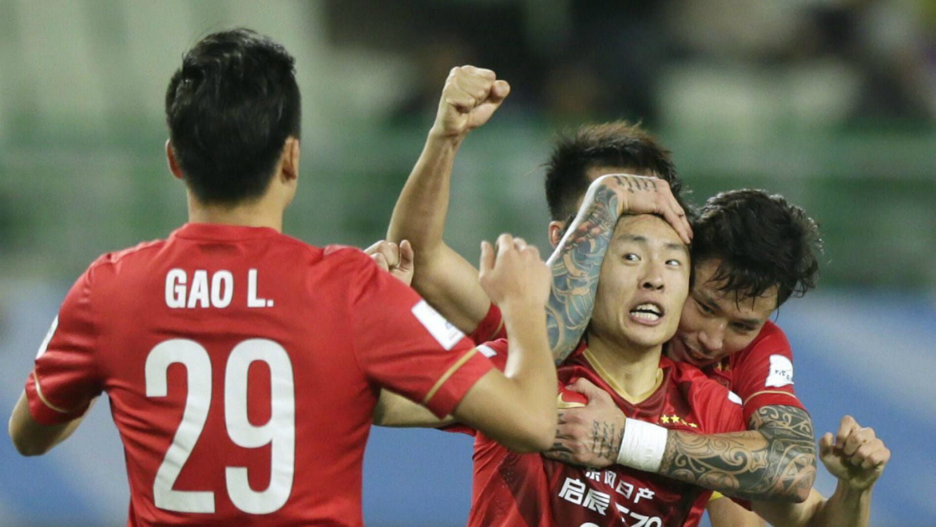 Zheng Long celebra un gol