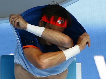 David Ferrer se quita la camiseta durante el partido contra Andy Murray David Ferrer se quita la camiseta durante el partido contra Andy Murray