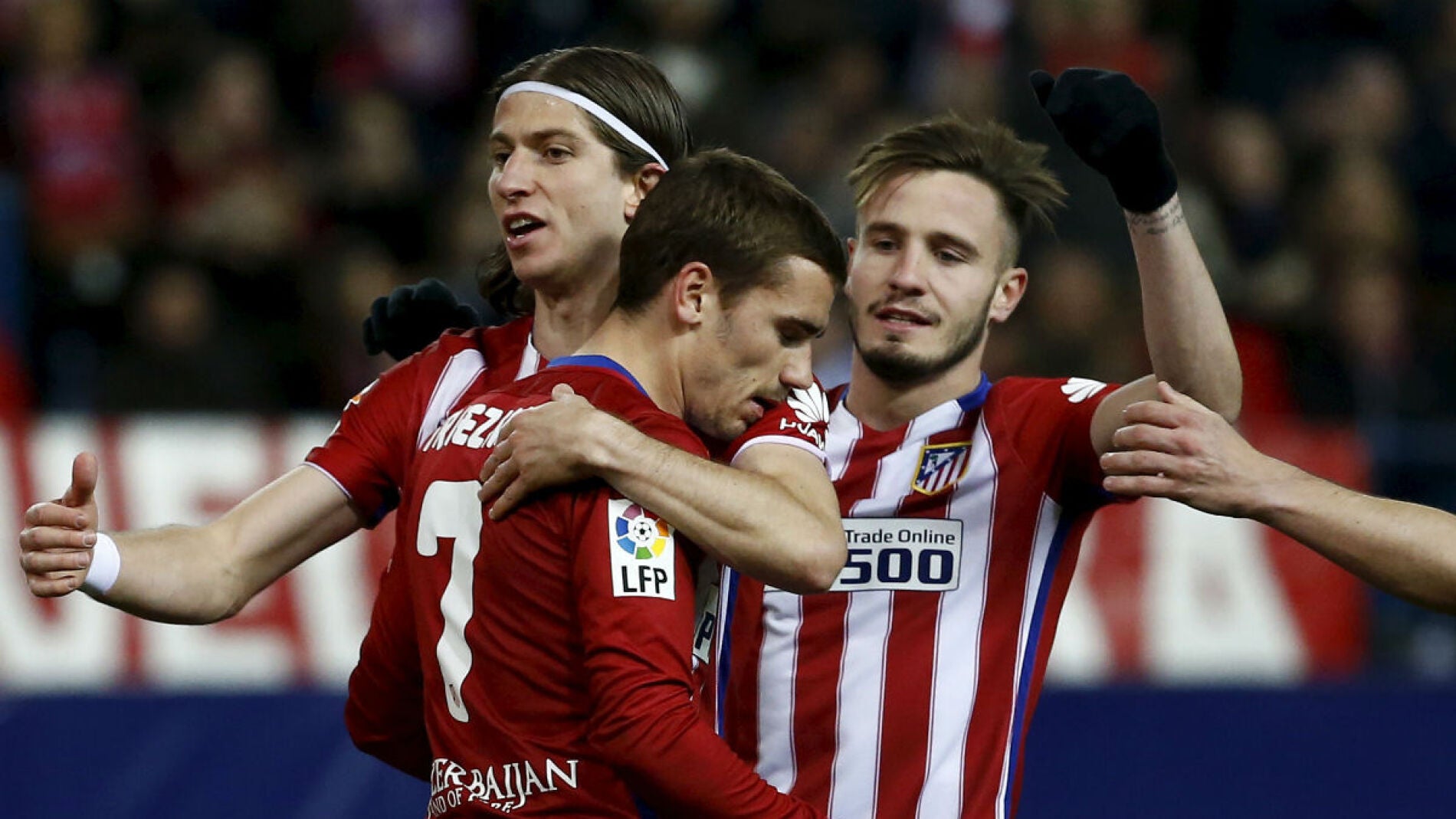 Filipe y Sa&uacute;l celebran el gol de Griezmann