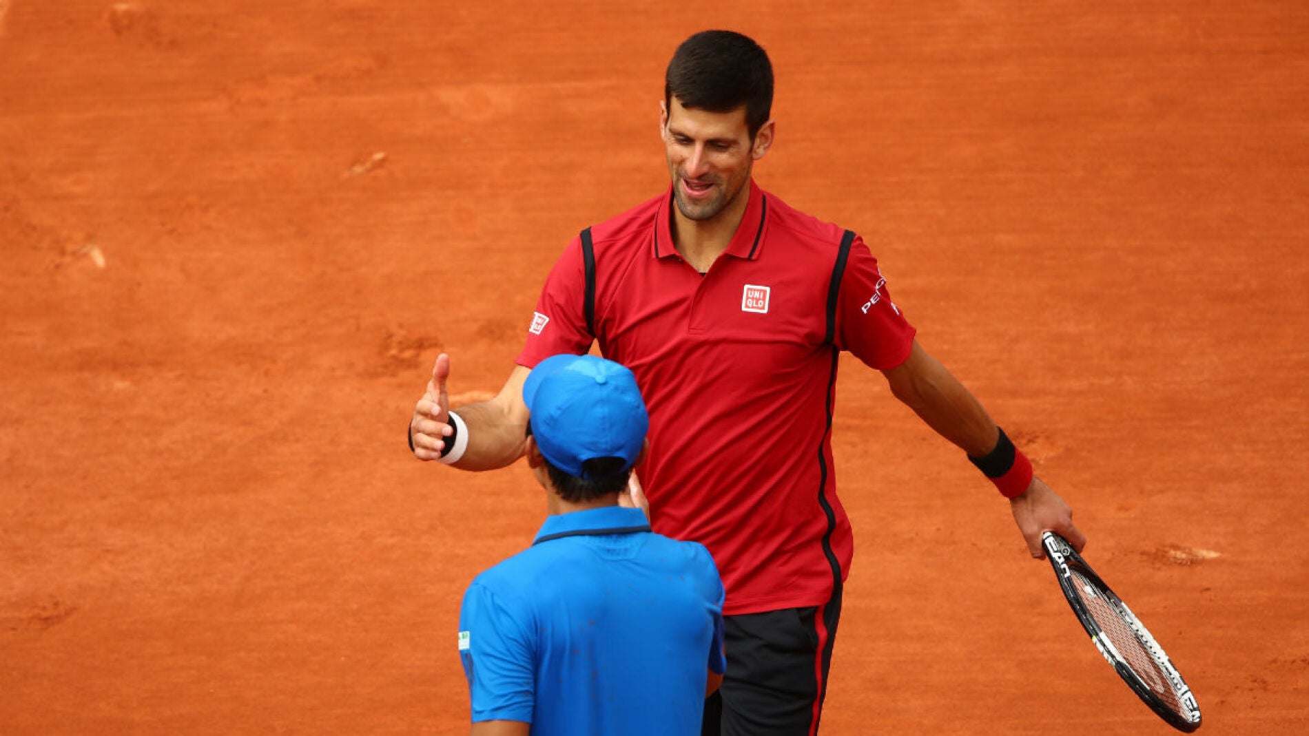 Djokovic saluda a Yen-Hsun Lu tras la victoria